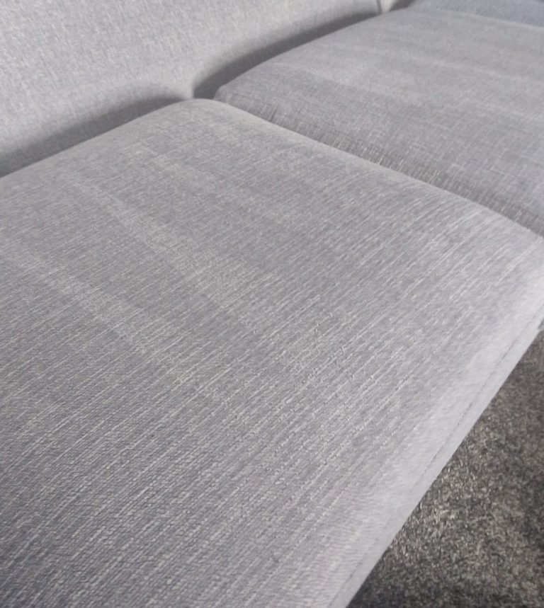 Clean Light grey upholstery on a modern sofa seat cushion in Dundee